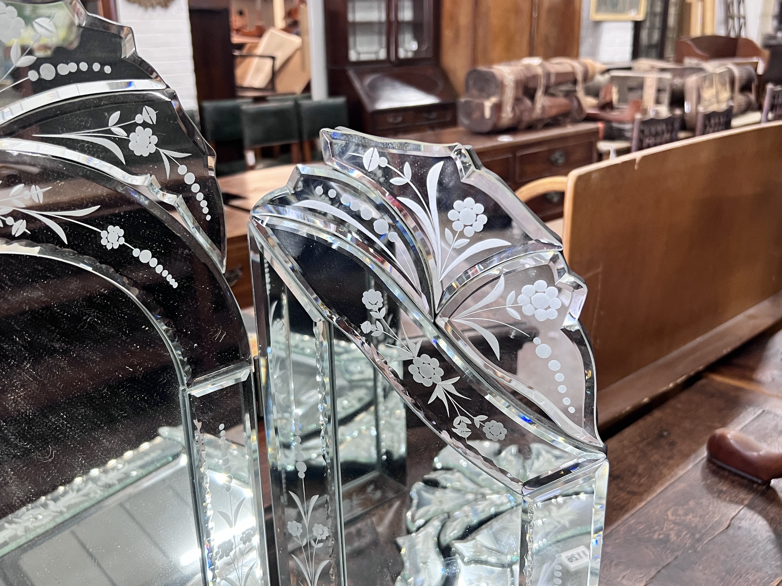 A Venetian style triple dressing table mirror, height 63cm together with a circular wall mirror, height 76cm